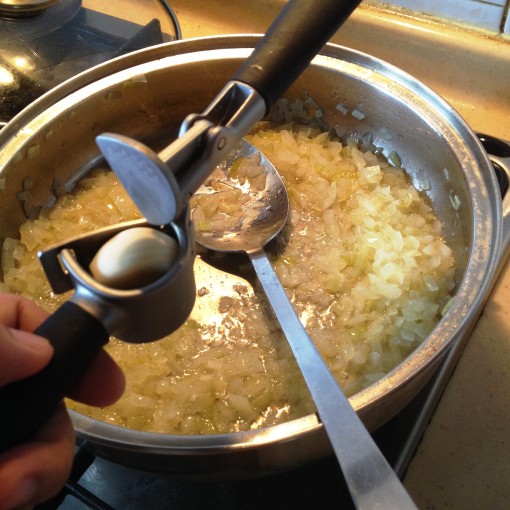 Press the garlic right over the pan.  I use my handy–dandy IKEA® garlic press.