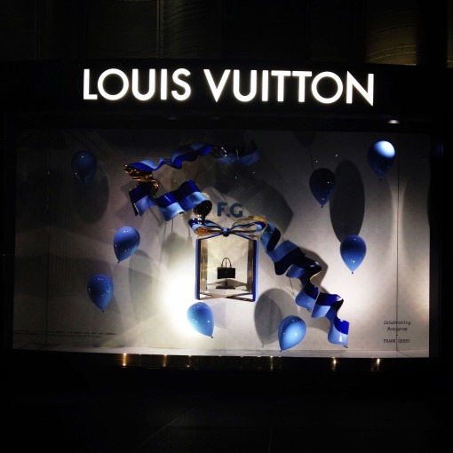 Blue is indeed the warmest color.  Louis Vuitton always does an excellent job dressing up their windows.  For this holiday season, it coincides with the Delphine Arnault–Nicolas Ghesquiere–initiated project dubbed “Celebrating Monogram,’ in commemoration of the house’s 160TH founding.  This is my favorite – “F.G.” stands for the iconoclast, THE Frank Gehry.